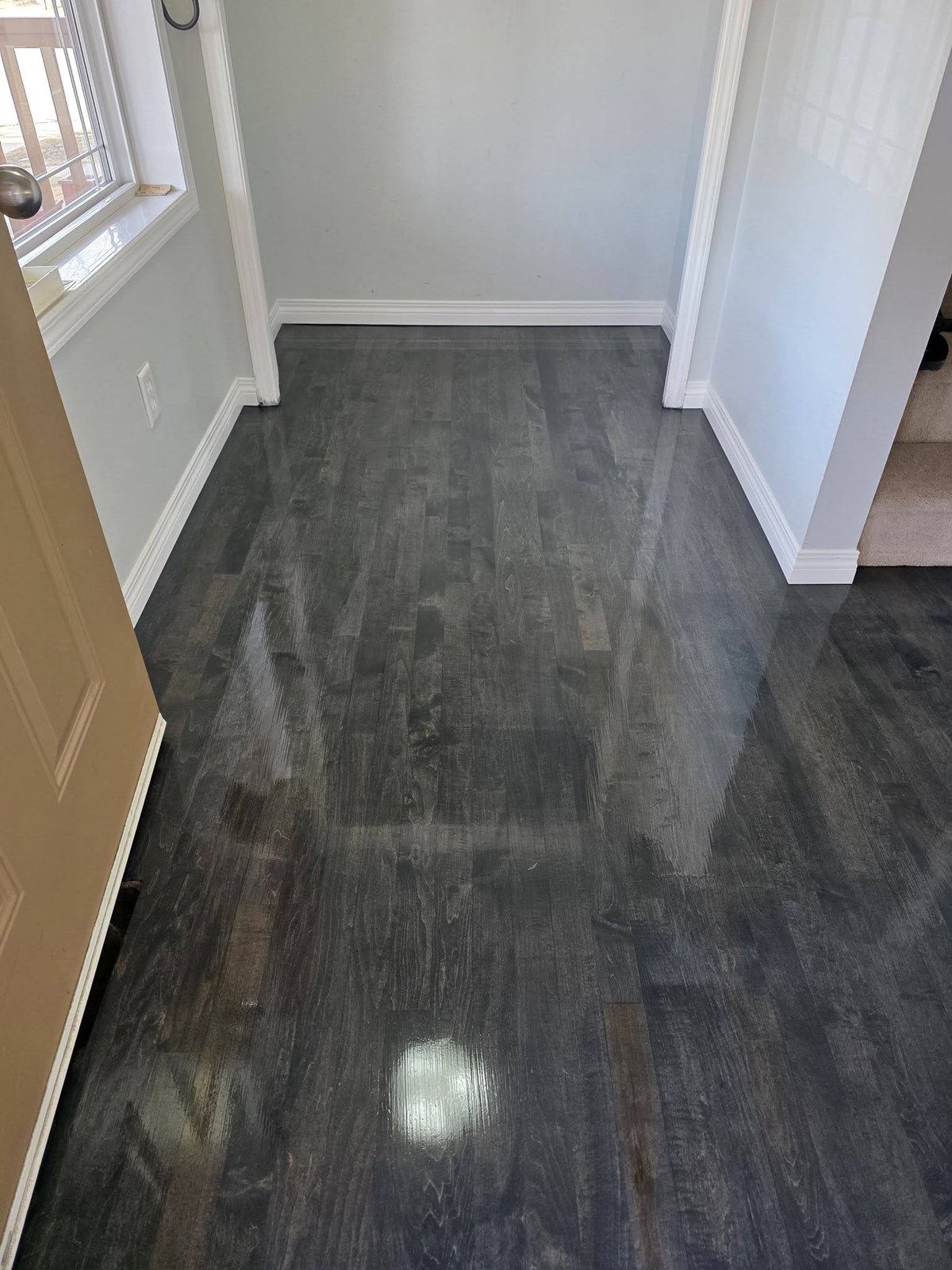 Maple hardwood entrance floor refinished with Bona Driftwood grey stain, Calgary Airdrie flooring